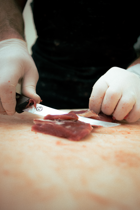Knife cutting meat