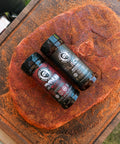 Two bottles of spice on a steak surface