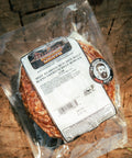 Packaged beef blend on a wooden surface with a label