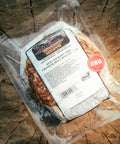 Packaged beef hickory BBQ on a wooden surface
