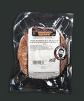 Packaged beef product with a label on a dark background