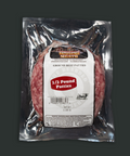 Packaged ground beef patties with a label on a dark background