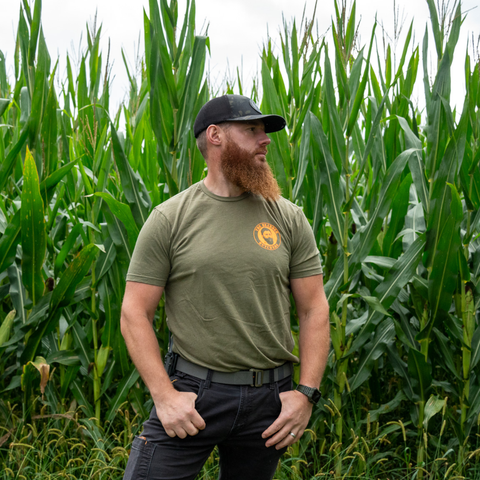 Bearded Butcher wearing Branded hunter green  t-shirt