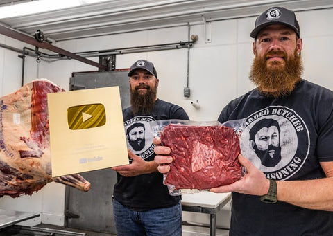 Scott and Seth holding YouTube Play Button and play button made of meat