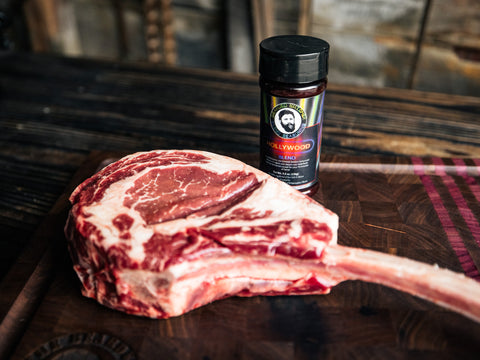 Hollywood Bearded Butcher Blend Seasoning by Tomahawk Steak on Cutting Board