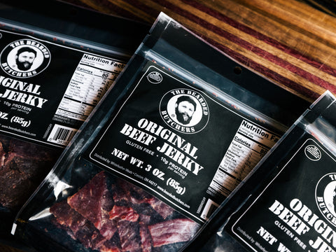 Bearded Butchers Original Beef Jerky in Packages on Cutting Board