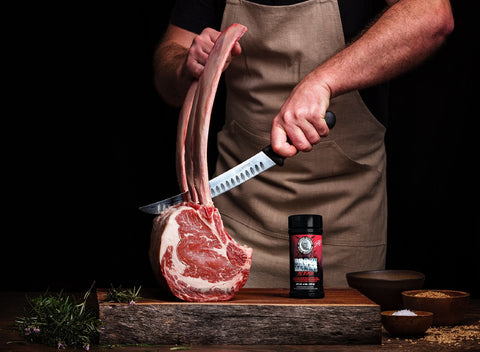 Bearded Butcher Brock Lesnar Blend Seasoning on Butcher Cutting Board with Meat and Spices