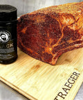 Bearded Butcher Blend Seasoning Black Shaker and Meat on Cutting Board