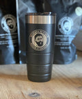 Bearded Butcher 22oz Vacuum Insulated Tumbler on Table with Coffee Bags